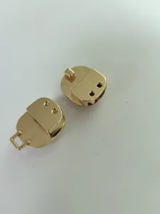 Gold metal bag lock hardware accessories, premium metallic purse clasp parts for DIY leather bags.