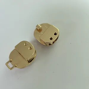 Gold metal bag lock hardware closure clasp components for handmade leather purses and handbags.