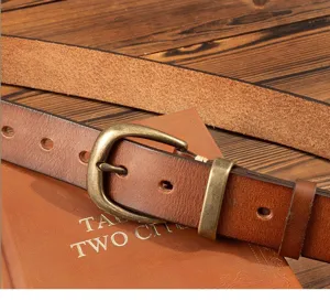 Vintage genuine leather belt detail showcasing thick cowhide texture and solid brass buckle.