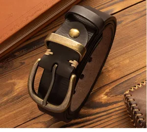 Men's retro genuine leather belt detail showcasing solid brass pin buckle and fine stitching.
