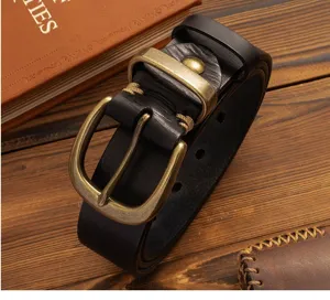 Detailed shot of vintage genuine leather men belt with brass buckle and handmade stitching.