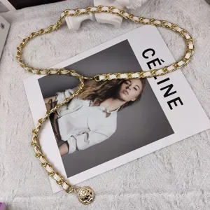 Elegant gold chain belt with white leather woven design, perfect chic accessory for dresses.