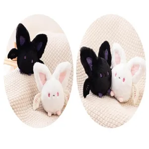 Macro detail showing cute round bat plush toys in black and white for Halloween decor