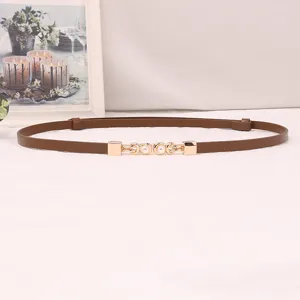 Women slim brown belt detail featuring golden metal buckle and pearl decoration for waist.