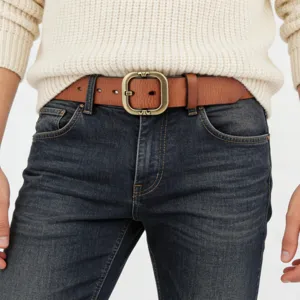 Vintage genuine leather women belt with stylish metal buckle, casual jeans waist accessory detail