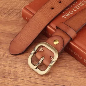 Vintage genuine cowhide leather belt detail, casual fashion waistband for jeans with retro buckle.