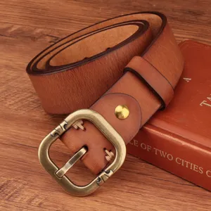 Vintage genuine leather belt detail shot showcasing retro brass buckle and premium cowhide texture.