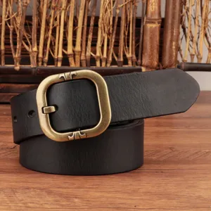 Retro black genuine leather belt detail featuring a vintage brass square buckle and fine texture.