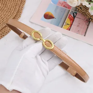 Exquisite women's thin leather belt with chic gold double buckle, elegant retro waist accessory.