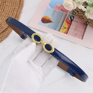 Women's narrow patent leather belt with vintage gold-tone double ring buckle accessory.