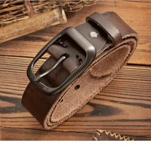 Close-up detail of vintage genuine leather belt with premium cowhide and sturdy metal pin buckle.