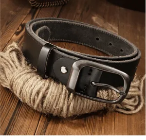 Close-up view of a genuine leather belt detail featuring a vintage metal pin buckle and texture.