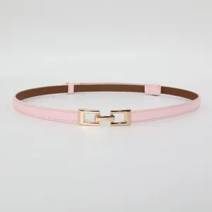 Pink thin leather belt with gold metal buckle detail, elegant accessory for summer dresses.