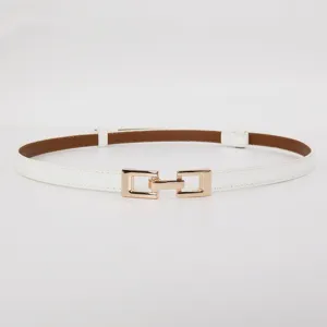 Detailed view of women's thin white leather dress belt featuring an elegant golden metal buckle.