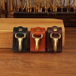 Leather key belt clip detail, metal hook and snap button, durable waist accessory for daily use