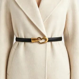 Women thin black leather belt with gold heart buckle, stylish coat waist accessory.