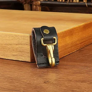 Leather belt key loop holder close up view, durable brass hook clip accessory for men daily use.