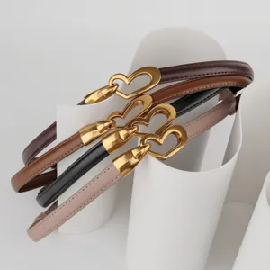 Women thin leather belt set with stylish gold heart buckle, perfect for dresses and coats.