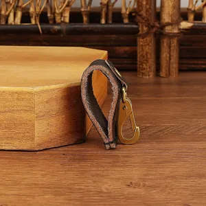 Detail view of durable leather belt key holder clip with brass hook for daily use.