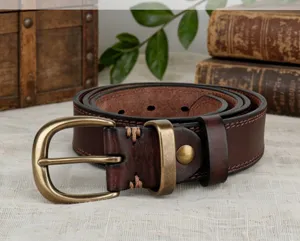 Detailed view of women's vintage vegetable-tanned genuine leather belt with antique copper buckle.