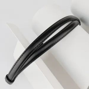 Detailed close-up view of a slim black leather belt featuring a stylish double strap design.