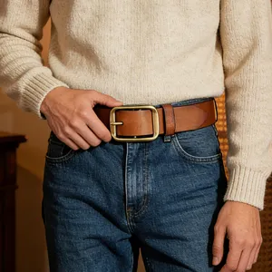 Classic brown leather belt with a vintage brass pin buckle, perfect for casual jeans and daily wear.