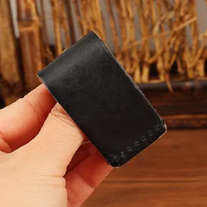 Black leather key belt loop holster detail, durable key hook accessory for waist belt daily use.