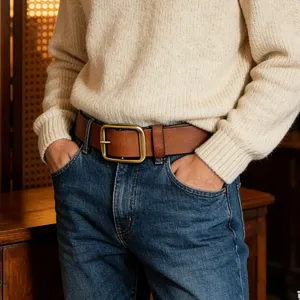 Classic brown leather belt for men with vintage gold-tone pin buckle jeans accessory.