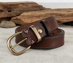 Women vintage vegetable tanned leather belt detail, casual cowhide strap with metal buckle.