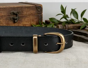 Women's vintage vegetable-tanned cowhide leather belt with durable brass buckle and fine stitching.