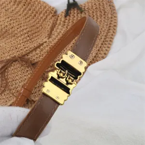 Close-up view of elegant brown leather belt featuring a unique vintage gold metal buckle.
