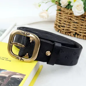 Vintage genuine leather belt for women with retro bronze buckle and unique embossed patterns.