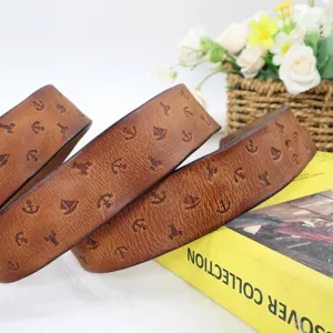 Close-up detail of a vintage brown genuine leather belt with embossed nautical patterns.