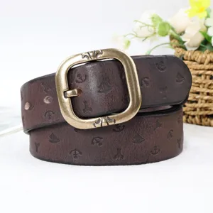 Detailed view of retro genuine leather belt with antique brass buckle and anchor patterns.