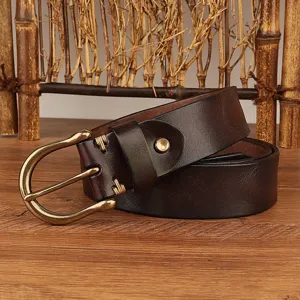 Vintage top layer cowhide mens leather belt featuring metal horseshoe buckle detail view.