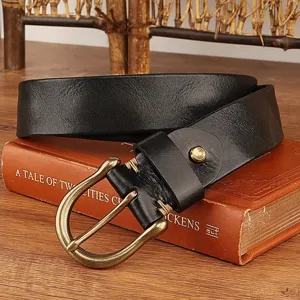 Detailed view of a classic black genuine leather belt with a vintage bronze buckle.