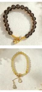 Close-up detail of natural citrine and smoky quartz bead bracelets with gold gourd charms.