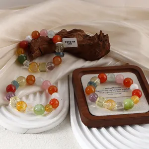 Detailed view of natural multi-gemstone crystal bracelets with agate on elegant display
