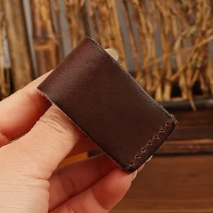 Genuine leather key case detail shot, handcrafted belt loop holder showing fine stitching.