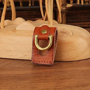 Handmade genuine leather belt key holder detail, brown cowhide brass D-ring waist clip.
