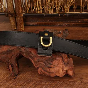 Leather belt key holder detail shot featuring genuine leather and brass D-ring.