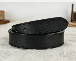 Black genuine leather belt detail shot, vintage stitched design, premium quality item.