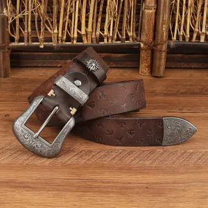 Retro genuine leather embossed pin buckle belt with carved metal hardware and floral design.