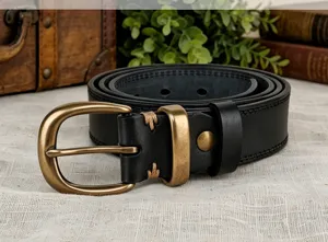 Detailed closeup view of womens vintage genuine leather belt showcasing brass buckle design.