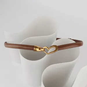 Women slim brown leather belt with gold heart buckle, stylish waist accessory for dresses.