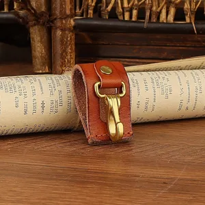 Genuine leather key holder with brass snap hook, durable belt loop accessory for men and women.