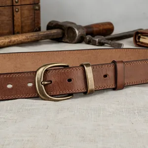 Women's vintage vegetable tanned leather belt with brass buckle, casual daily waist accessory.