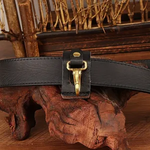 Close-up detail of the black leather belt key holder hook accessory with brass metal clasp.