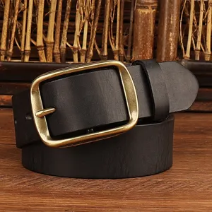 Detailed close-up shot of black leather belt with antique brass square buckle on wood.