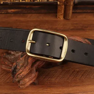 Close-up detail of a classic black leather belt with a vintage brass metal pin buckle.